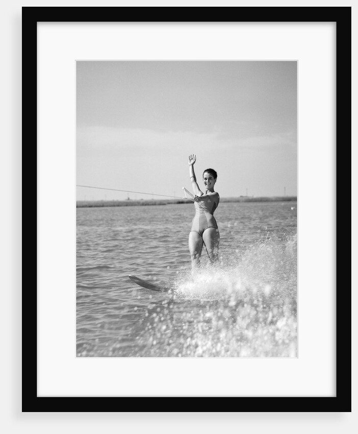 1960s Woman Water Skiing Waving With One Hand by Anonymous