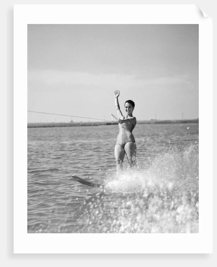 1960s Woman Water Skiing Waving With One Hand by Anonymous