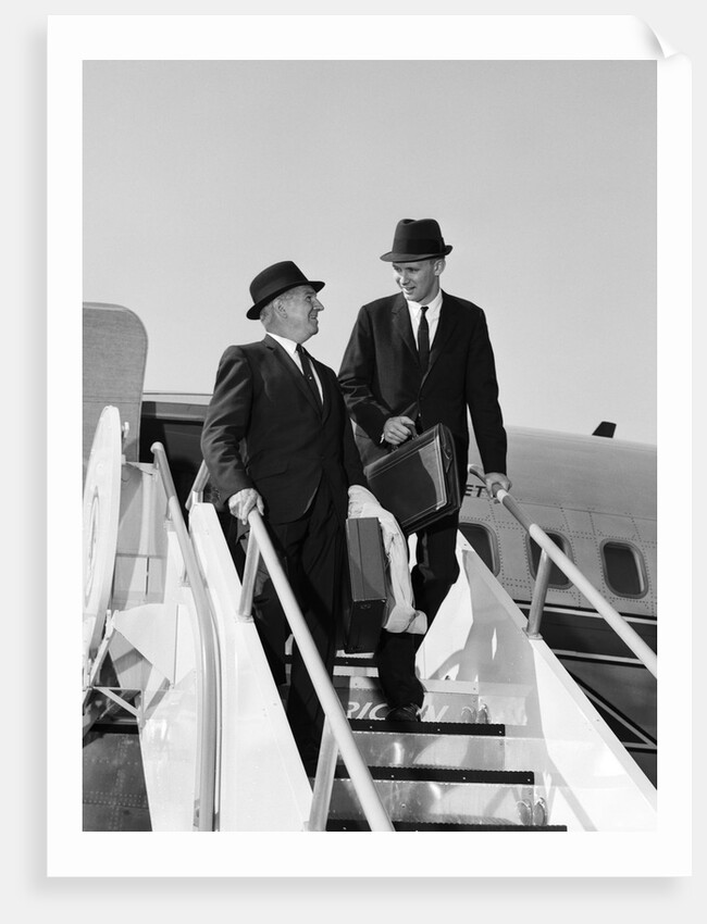 1960s Two Business Men Briefcase Exit Airplane Steps by Anonymous