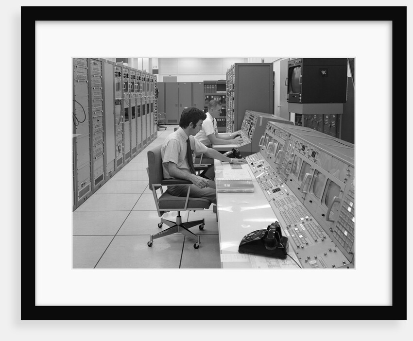 1960s 1970s Computer Room Mission Control Center Houston Texas 2 Men Sitting At Console by Anonymous