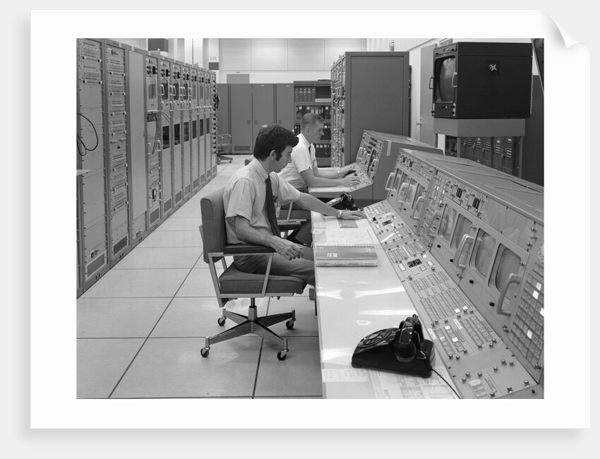 1960s 1970s Computer Room Mission Control Center Houston Texas 2 Men Sitting At Console by Anonymous