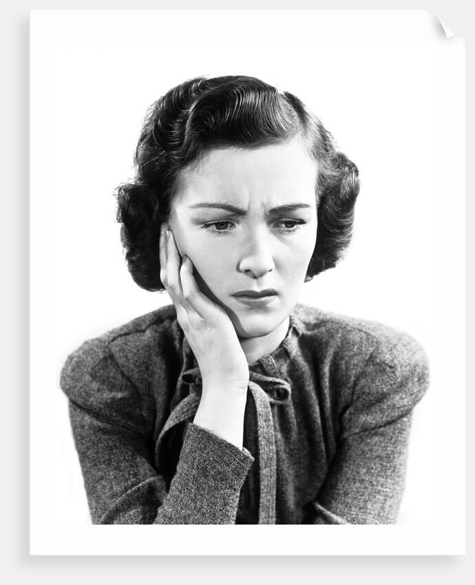 1940s Worried Woman Frowning Holding Hand To Cheek by Anonymous