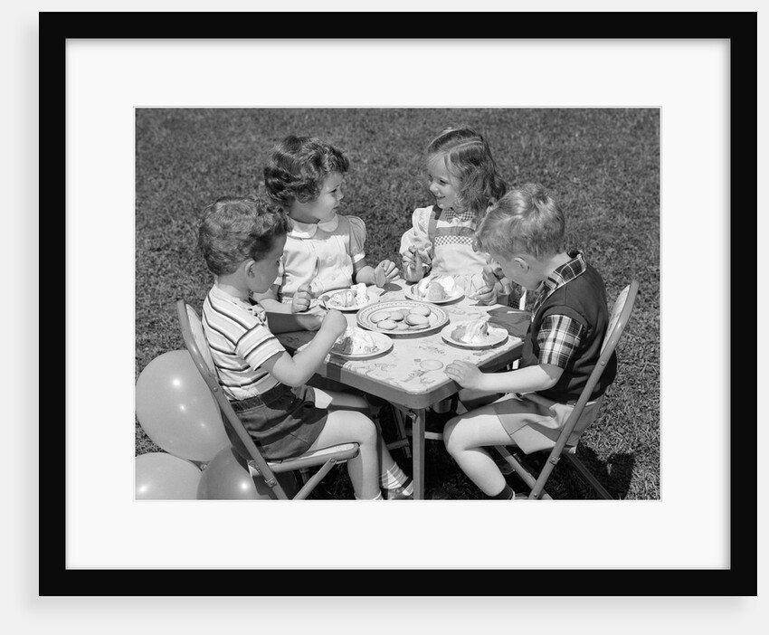 1950s Boys and Girls At Table Eating Cookies and Ice Cream For Birthday Party by Anonymous