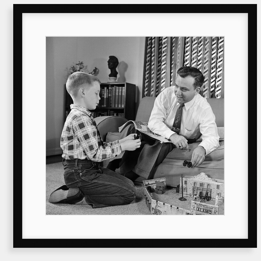 1950s Father And Son Playing With Cowboy Toy Game In Living Room Indoor by Anonymous