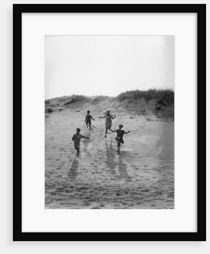 1920s 4 Kids 2 Boys 2 Girls Running Down Sand Dune by Corbis