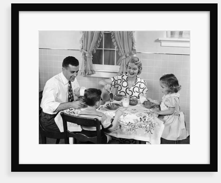 1950s Family Sitting At Kitchen Table Having Breakfast by Anonymous