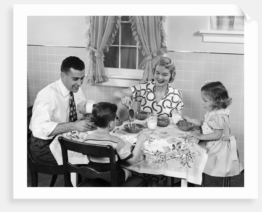 1950s Family Sitting At Kitchen Table Having Breakfast by Anonymous