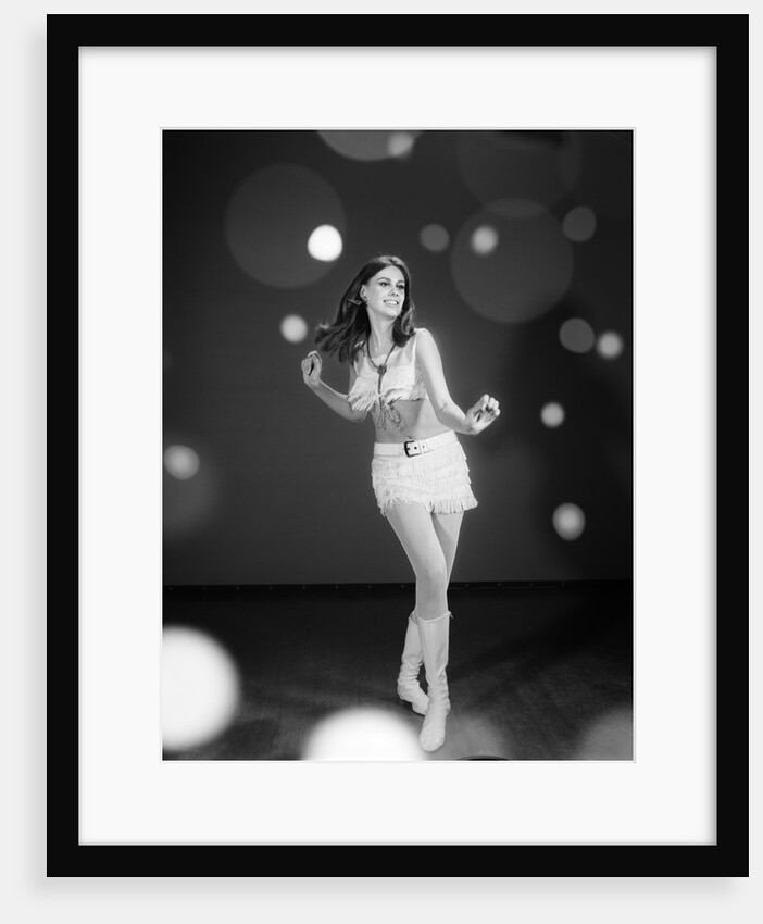 1960s Woman Dancing In White Fringed Halter Top Mini-Dress Skirt And Go-Go Boots by Anonymous