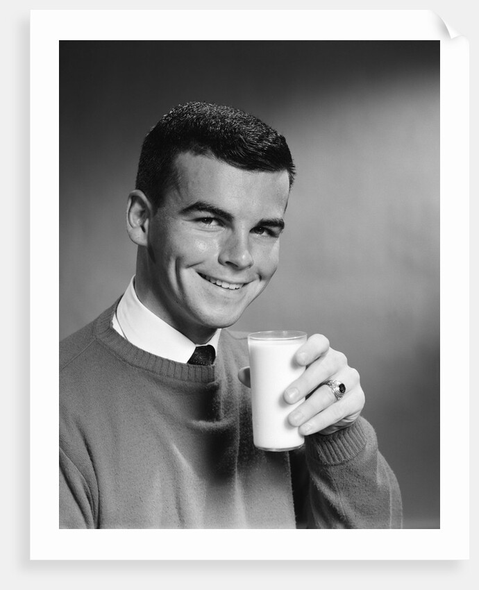 1960s Young Man Holding Glass Of Milk by Anonymous