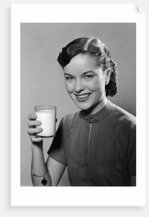 1950s Portrait Woman Holding A Glass Of Milk Studio by Anonymous