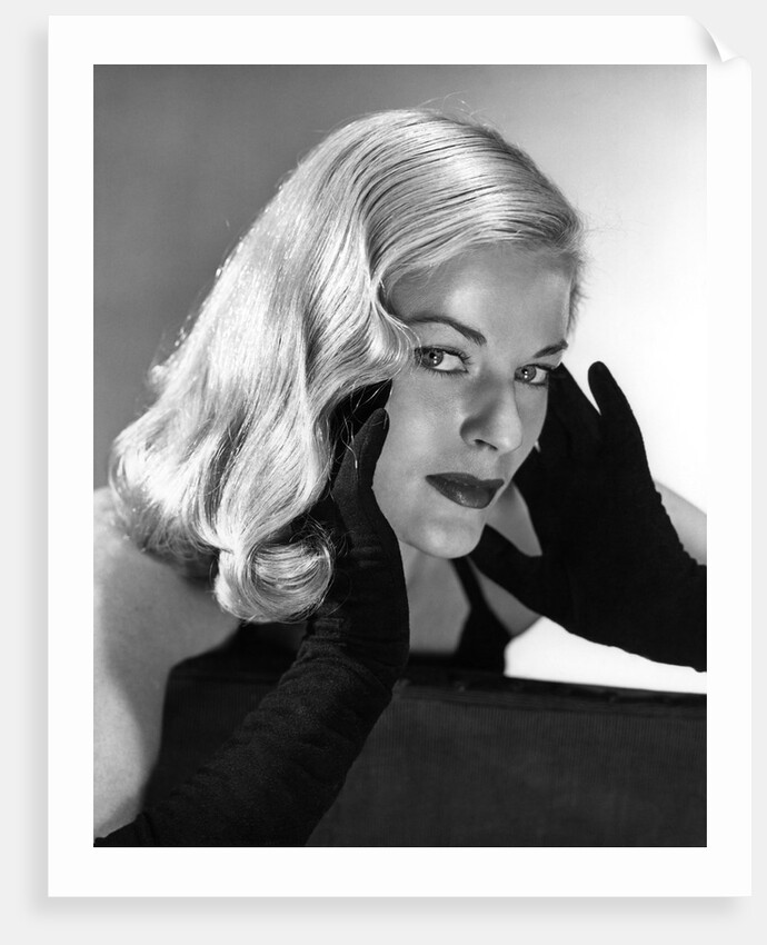 1950s Portrait Of Glamorous Woman With Long Black Gloved Hands Touching Cheek by Anonymous