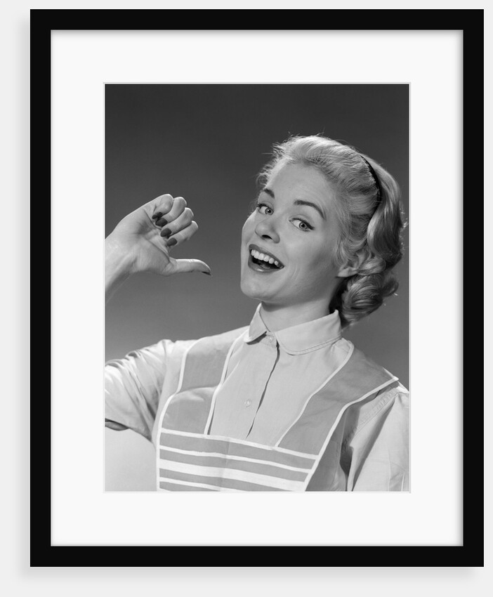1950s 1960s Woman Housewfe In Apron Proudly Pointing At Herself With Thumb by Anonymous