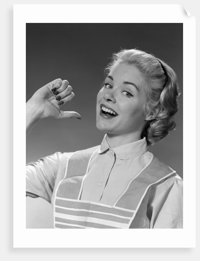 1950s 1960s Woman Housewfe In Apron Proudly Pointing At Herself With Thumb by Anonymous