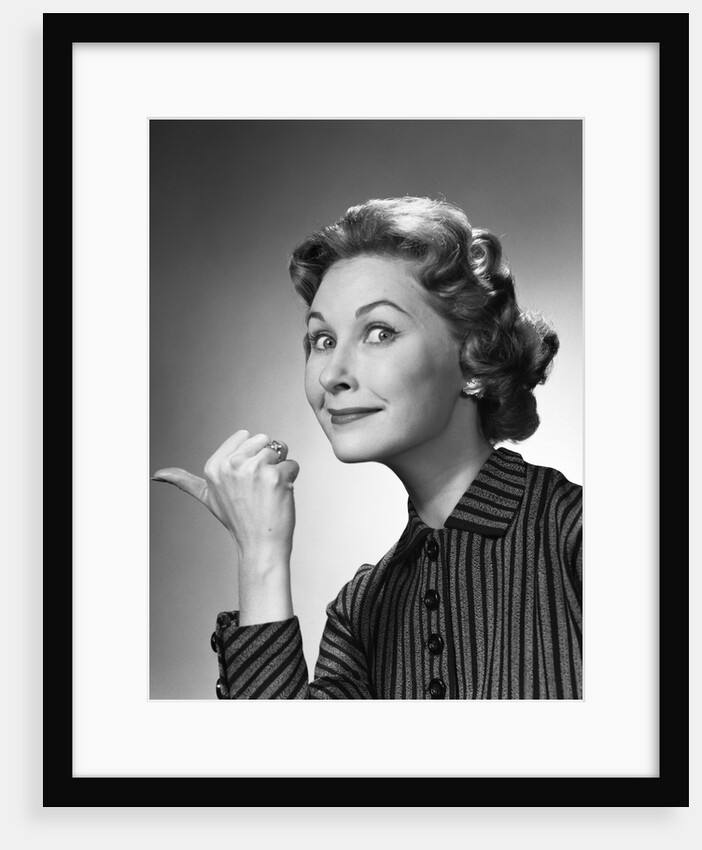 1960s Portrait Of Proud Woman Making Go Away Gesture With Thumb Studio by Anonymous