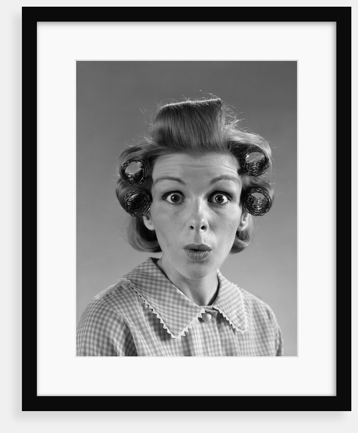 1960s Portrait Woman With Hair In Rollers Eyes Wide With Suprise by Anonymous