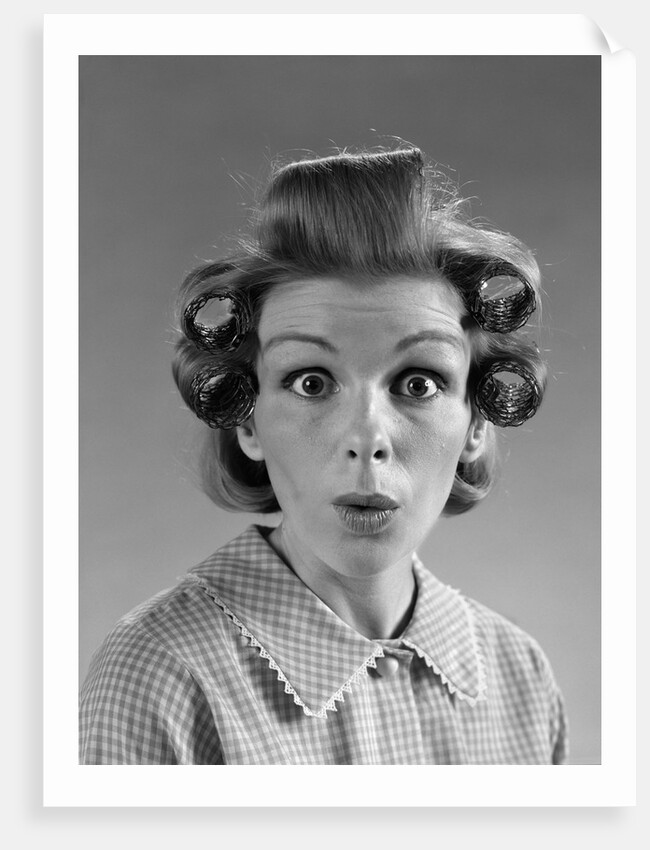 1960s Portrait Woman With Hair In Rollers Eyes Wide With Suprise by Anonymous
