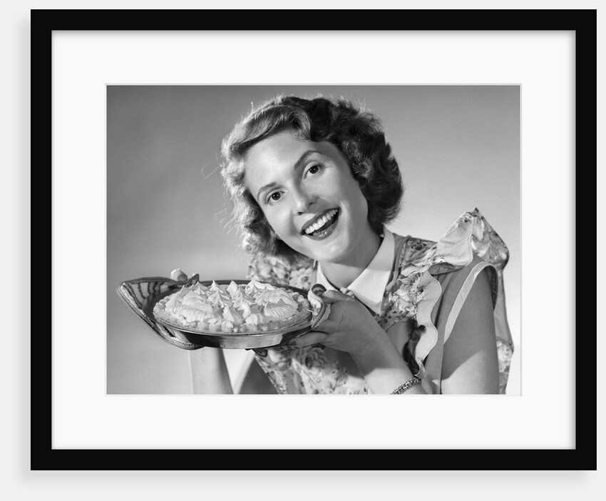 1950s Woman Presenting Holding Freshly Baked Pie by Anonymous