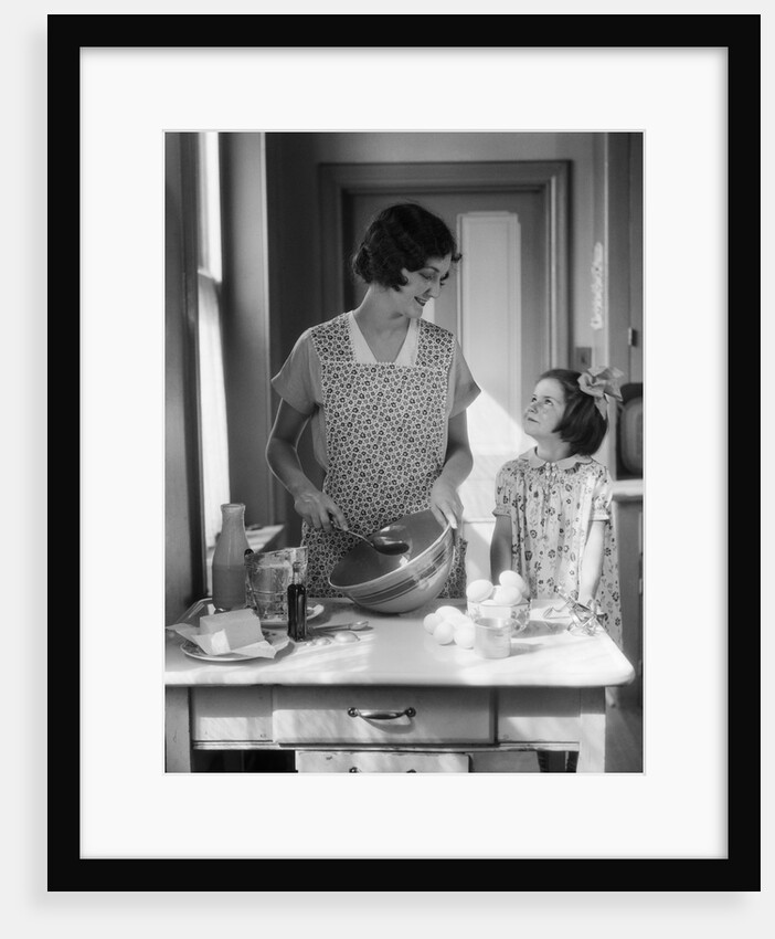 1920s 1930s Mother With Mixing Bowl In Kitchen With Daughter by Anonymous