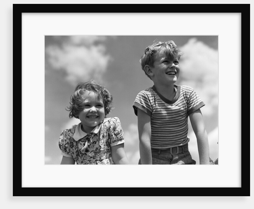 1930s Boy And Girl Bright Summer Day Sky With Clouds by Anonymous