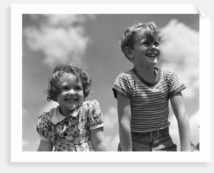 1930s Boy And Girl Bright Summer Day Sky With Clouds by Anonymous