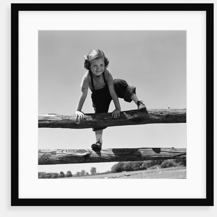 1940s 1950s Girl Climbing Over Wooden Fence by Anonymous