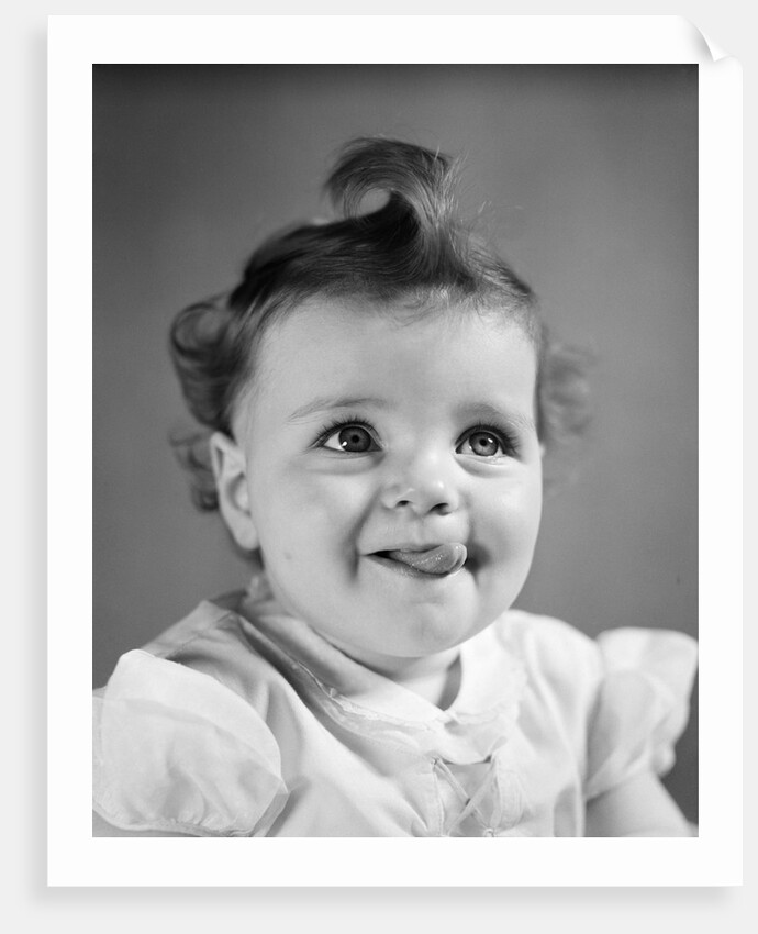1940s Baby Girl Sticking Out Her Tongue by Anonymous