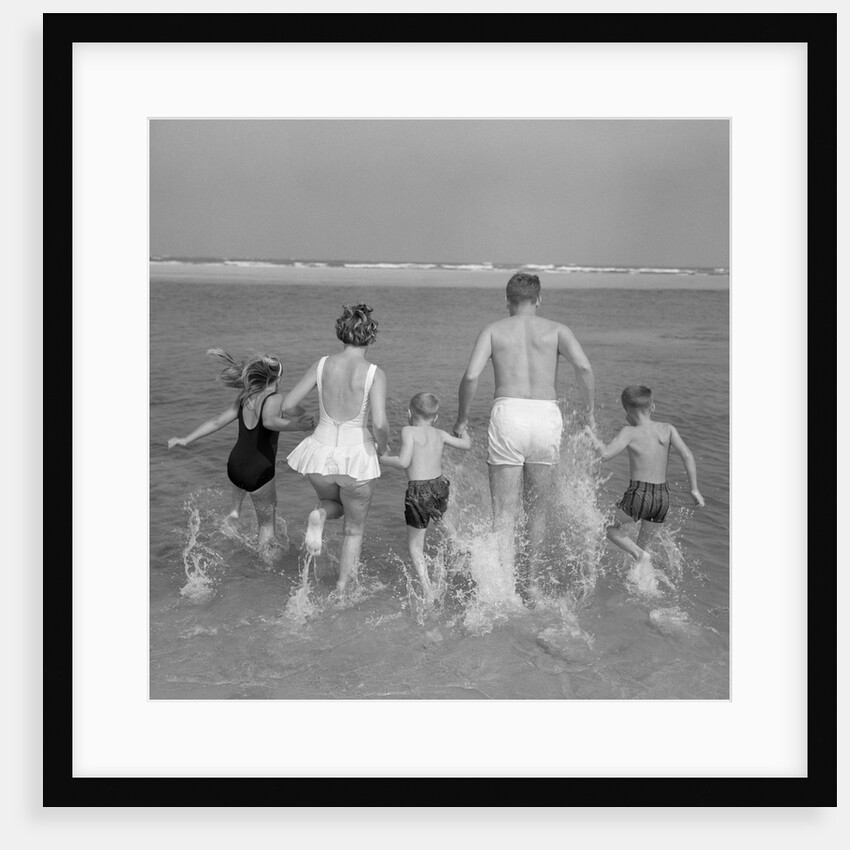 1960s Back View Of Family Of 5 Holding Hands Running Into Ocean by Anonymous