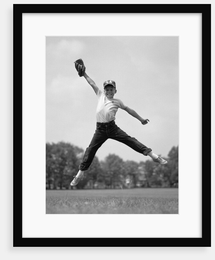 1960s Boy Jumping In Outfield To Catch Baseball With Gove by Anonymous