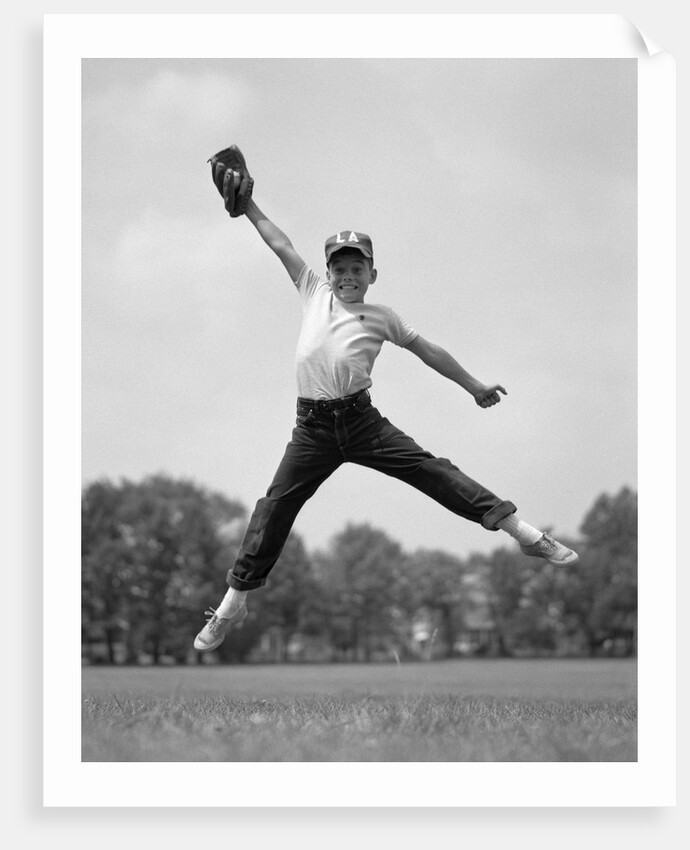 1960s Boy Jumping In Outfield To Catch Baseball With Gove by Anonymous