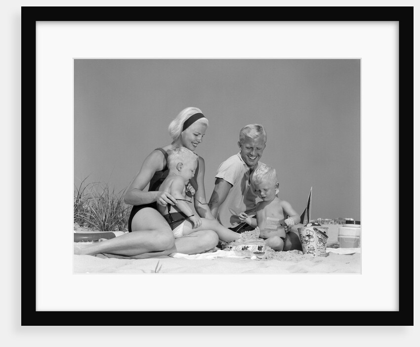 1970s 1960s Family Father Mother Twin Sons Playing In Sand On Beach Outdoor by Anonymous