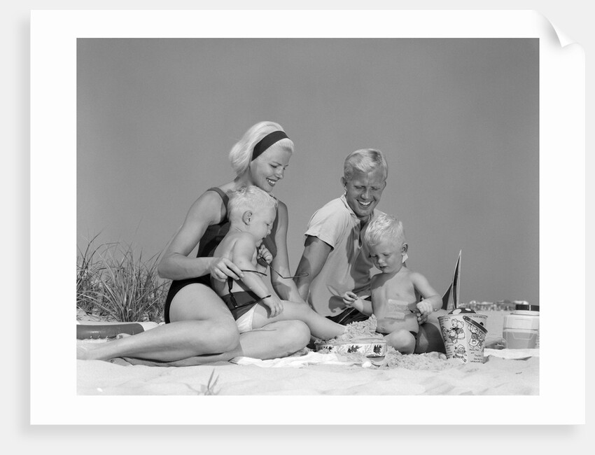 1970s 1960s Family Father Mother Twin Sons Playing In Sand On Beach Outdoor by Anonymous