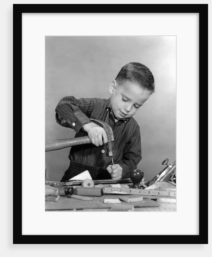 1950s Boy Playing With Hammer And Tools by Anonymous