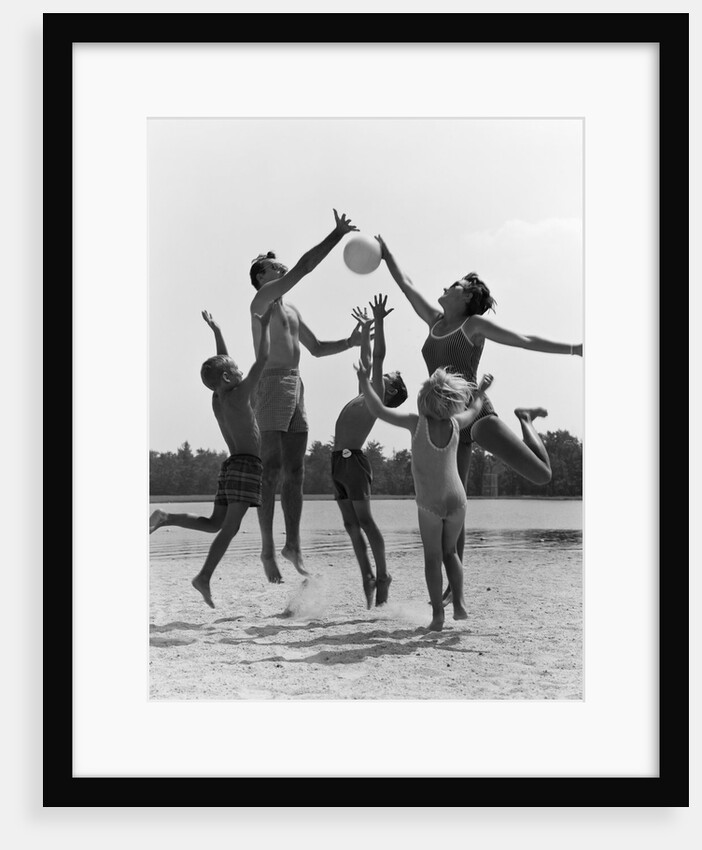 1960s Family Jumping Playing Beach Volleyball by Anonymous