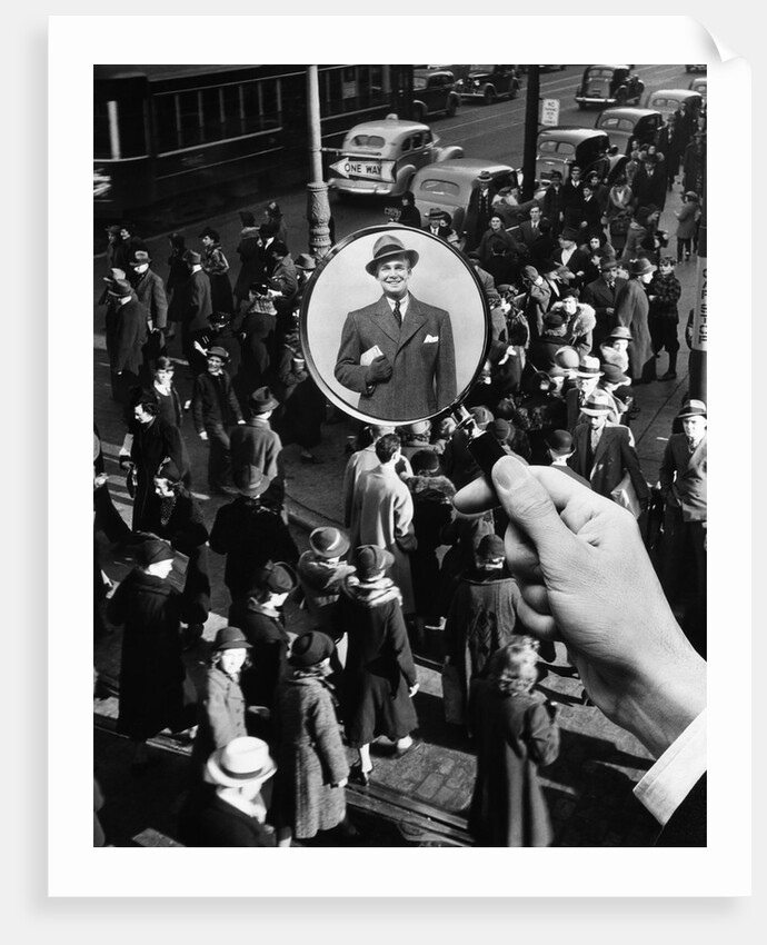 1930s 1940s Pedestrian Street Crowd Magnifying Glass Focused On Single Well Dressed Man by Anonymous