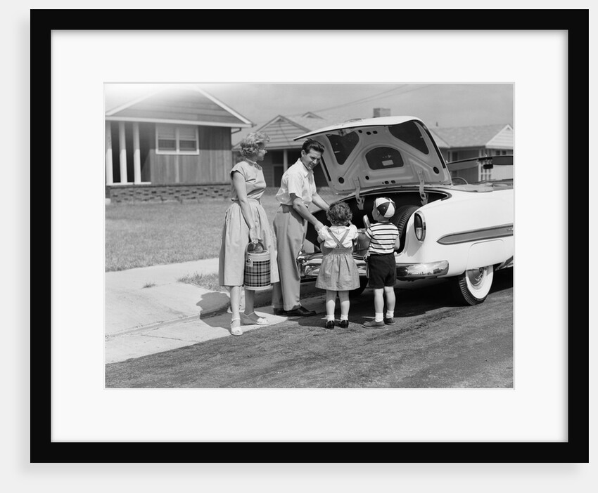 1950s Family Packing Trunk Of Car For A Picnic by Anonymous