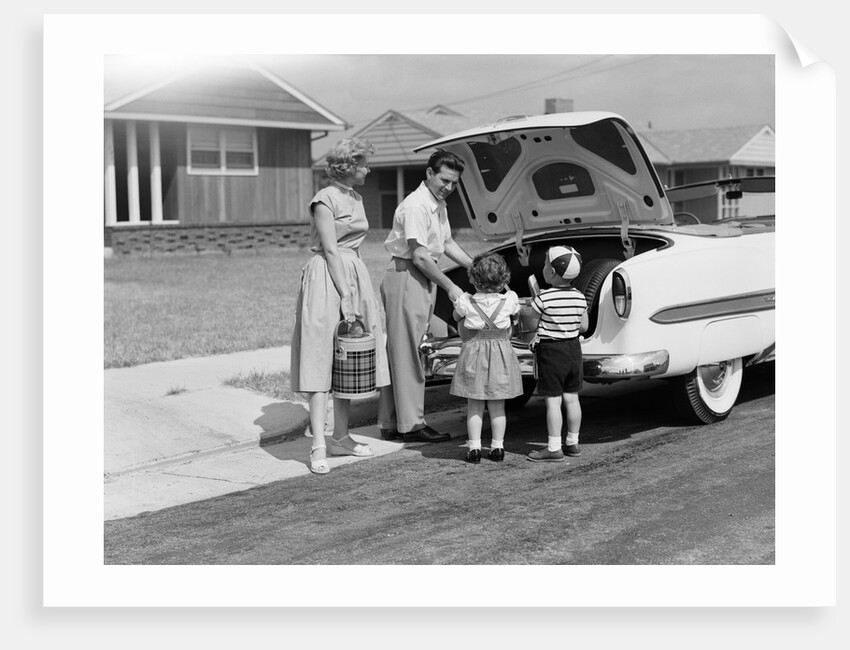 1950s Family Packing Trunk Of Car For A Picnic by Anonymous