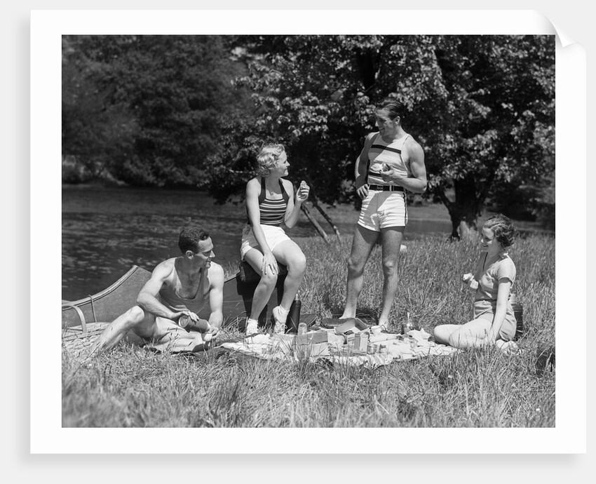 1930s Two Couples Having Summer Picnic With Food And Drink Spread Out On Blanket The Tip Of A Canoe Is Visible by Anonymous