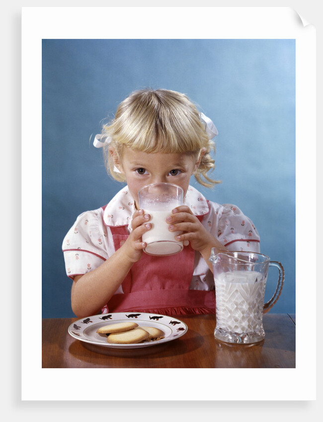 1950s 1960s Girl Drinking Milk Plate Cookies by Anonymous