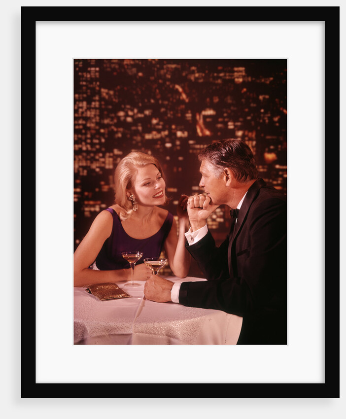 1960s 1970s Romantic Couple in Formal Evening Dress In A Nightclub Drinking Champagne by Anonymous