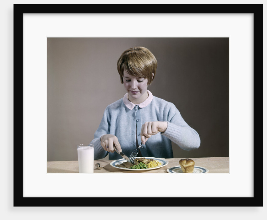 1960s Teenage Girl Eating Wholesome Dinner by Anonymous