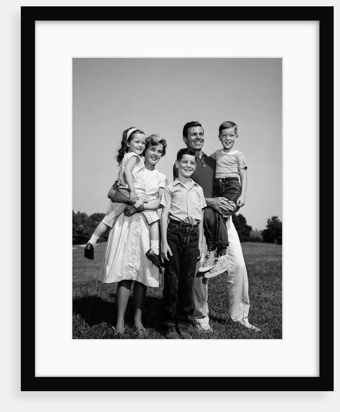 1960s Family Portrait Father Mother Daughter Son Standing Together Outdoors by Anonymous