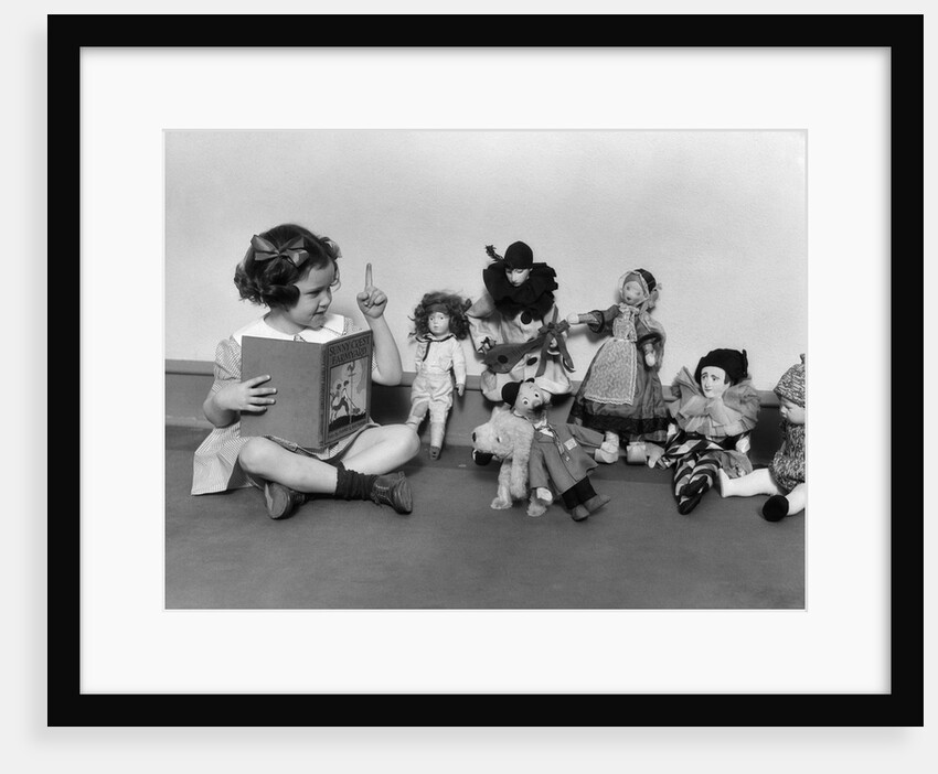 1930s Girl Pointng A Finger Reading To A Row Of Dolls Toys Stuffed Animals by Anonymous