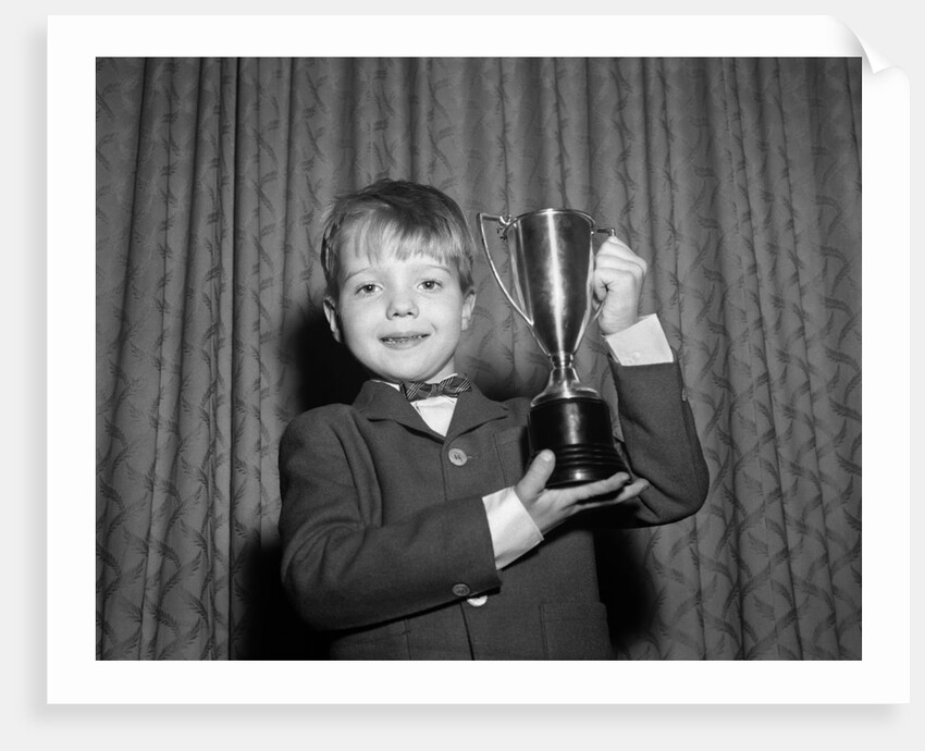 1950s Proud Boy Holding Up Trophy Award by Anonymous