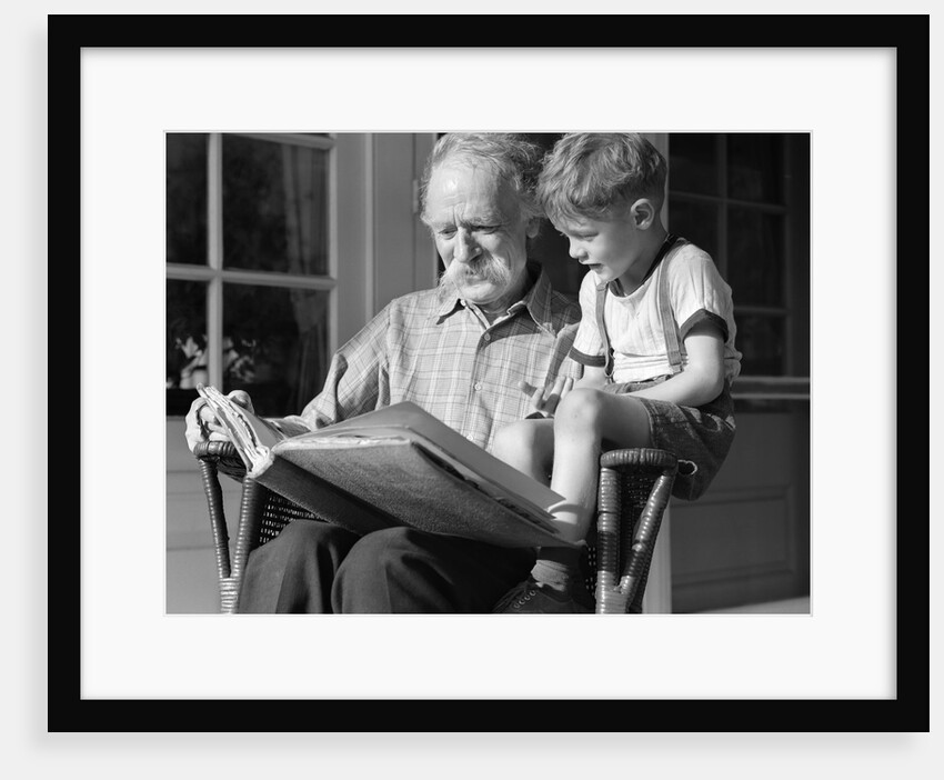 1940s Grandfather On Porch Reading To Grandson by Anonymous
