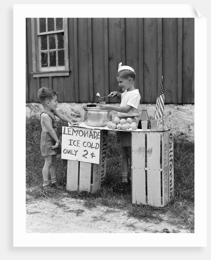 1930s 1940s Boy With Lemonade Stand Selling To Little Boy In Short Pants by Anonymous