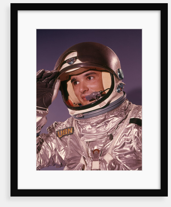 1960s Man Astronaut Lifting Up Visor Helmet Wearing Silver Navy Space Suit by Anonymous