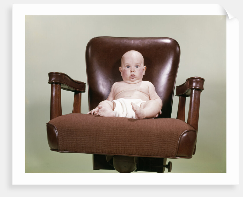 1960s Chubby Bald Baby Wearing Cloth Diaper Sitting In Executive Office Business Chair by Anonymous