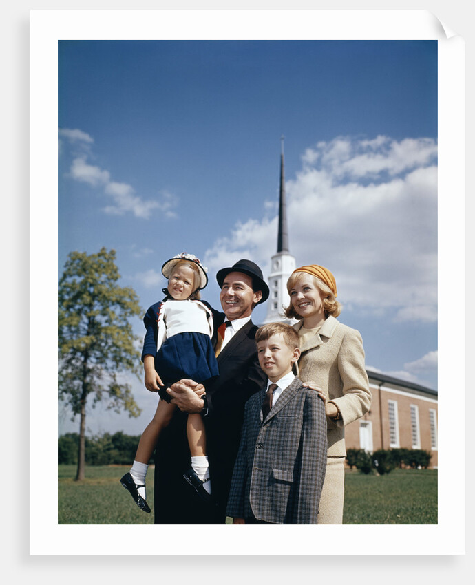 1960s Portrait Family Standing Together In Front Of Church Outdoor by Anonymous
