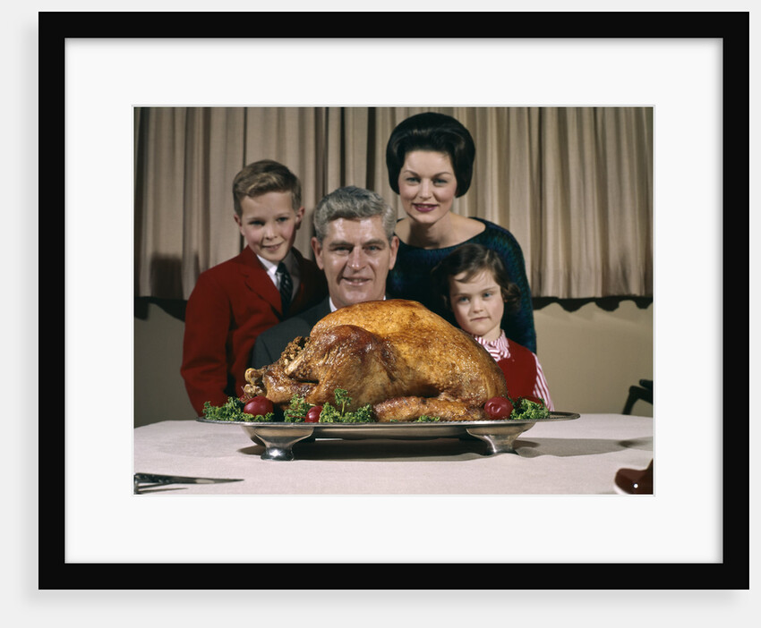 1960s Portrait Of Family Looking At Thanksgiving Or Christmas Roast Turkey by Anonymous