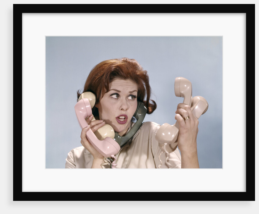 1960s Frustrated Young Redheaded Woman Trying To Answer Handle Five Telephone Receivers Studio by Anonymous